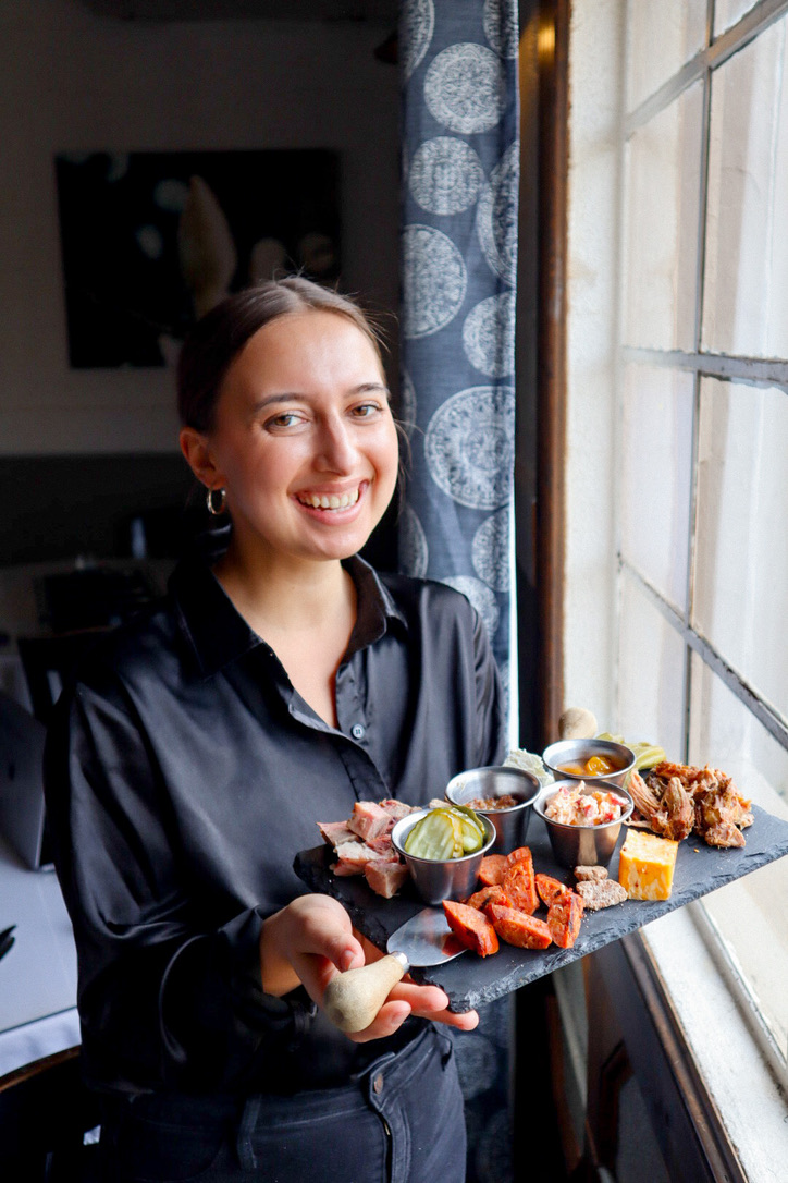 server holding food at Southern Food Restaurant in Madison